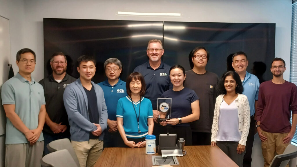 Group shot of ESI staff holding the 2025 Inc 5000 Fastest Growing Company award.